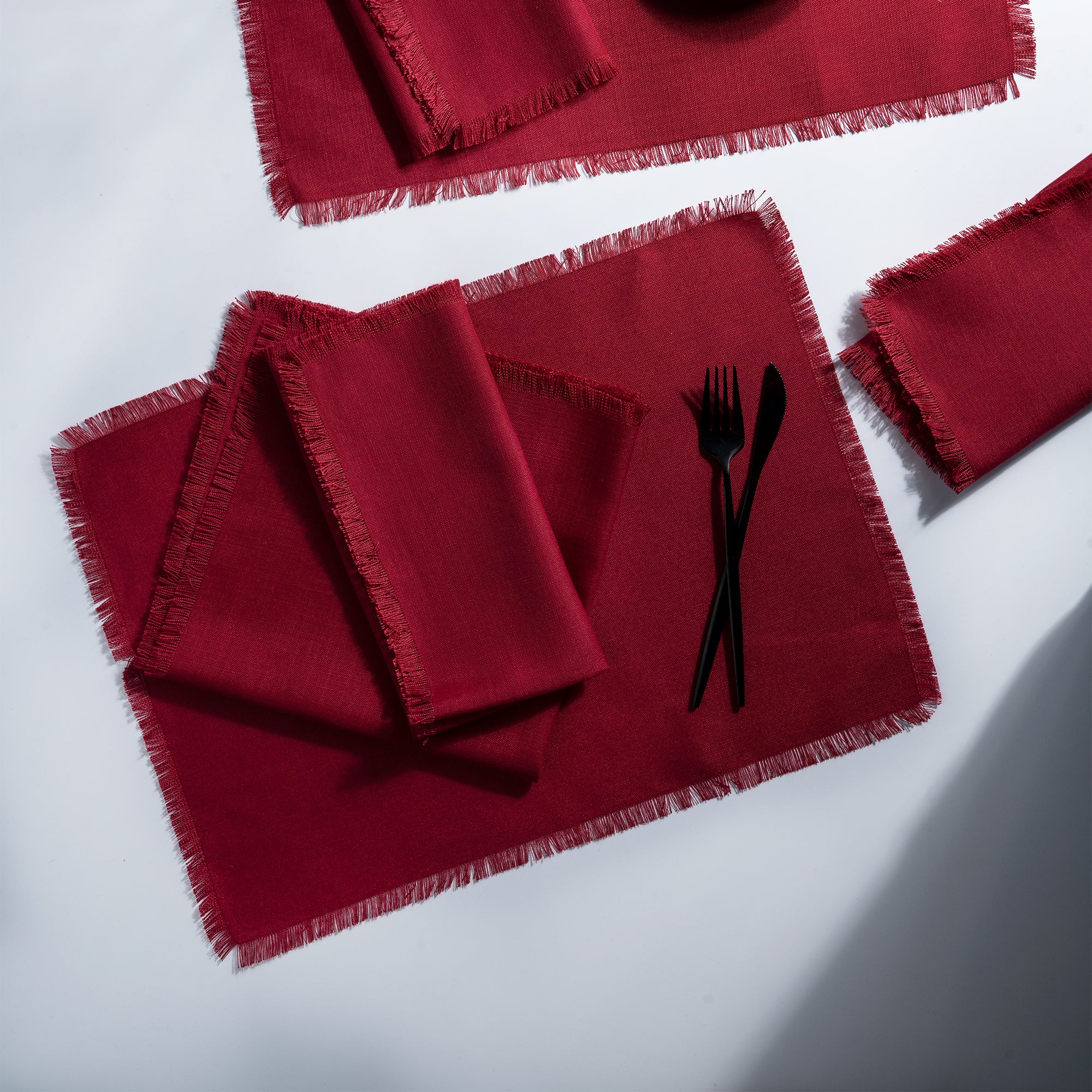 Red faux linen placemats styled on a dining table