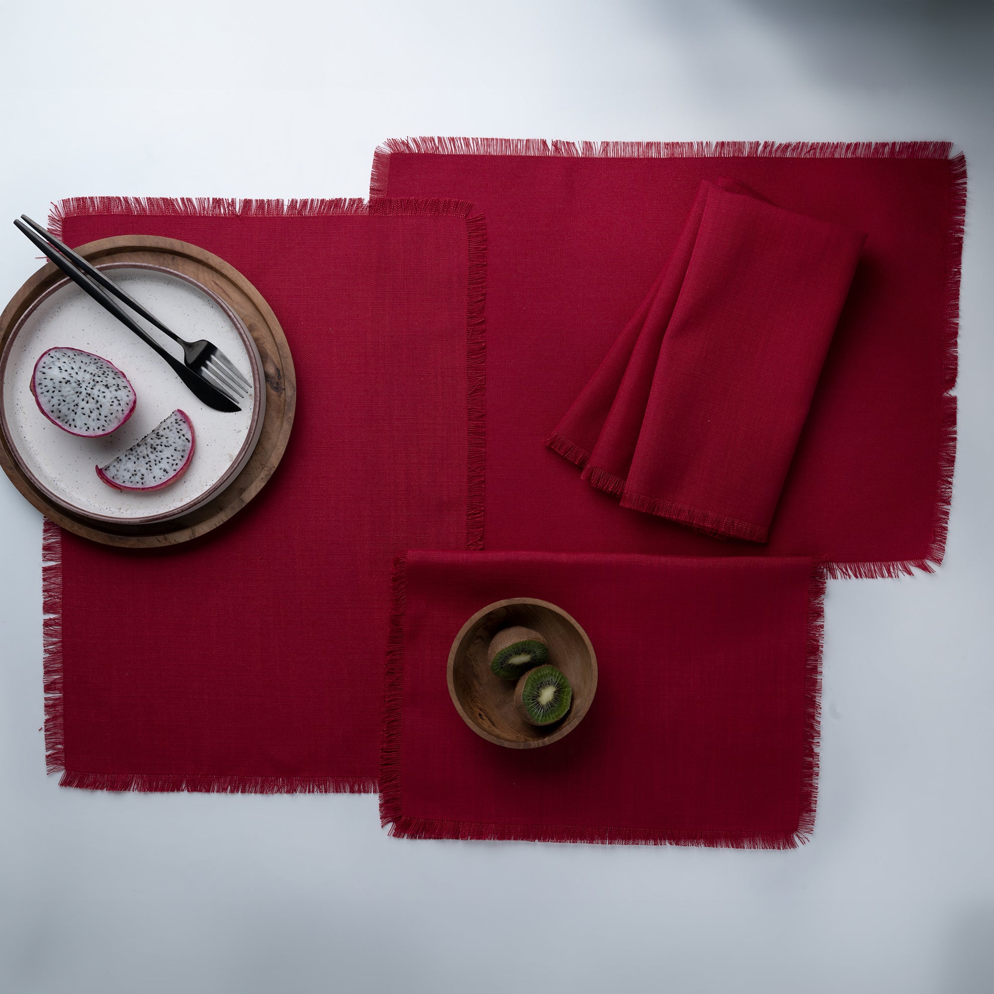 Close-up of the fringed edge on red faux linen placemats