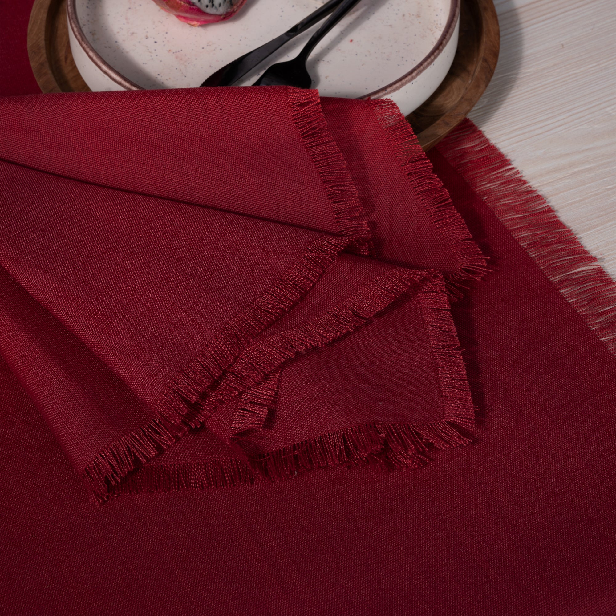 Red faux linen dinner napkins with matching D'Moksha table linens