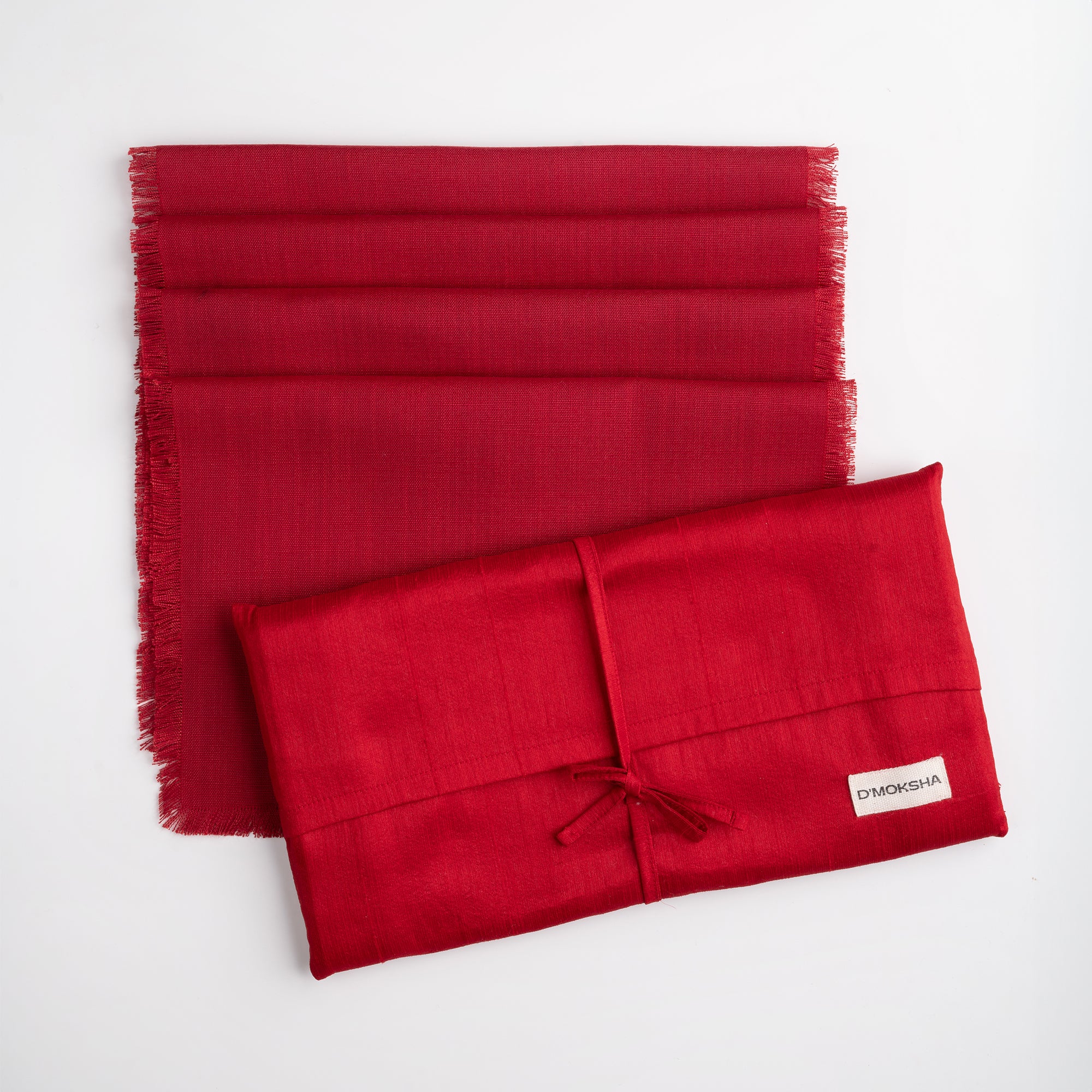 Red faux linen placemats in a set table setting