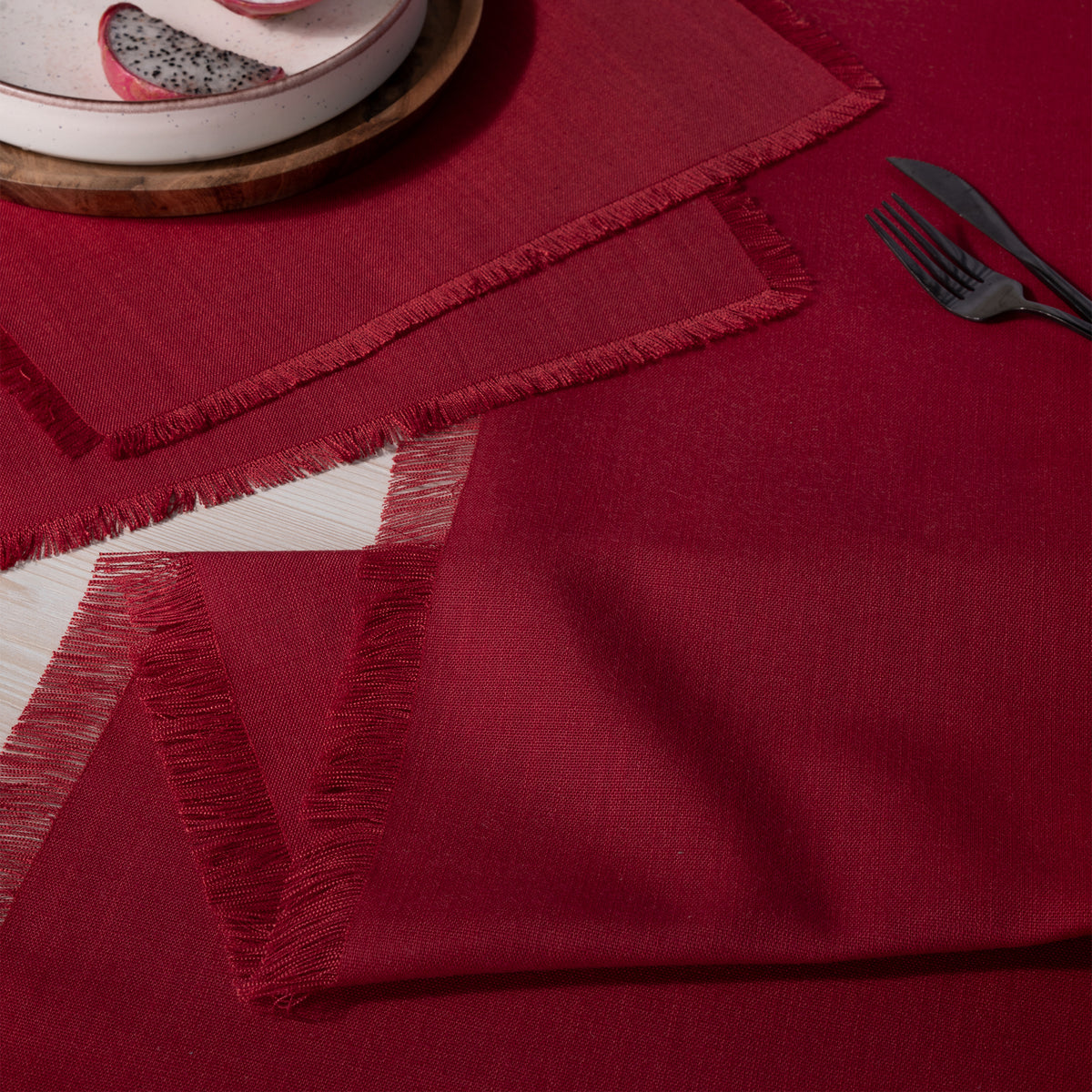 Red faux linen table runner with matching D'Moksha table linens