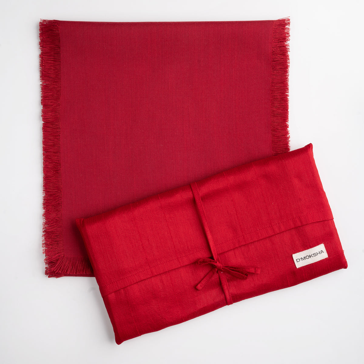 Red faux linen table runner folded to show fabric texture