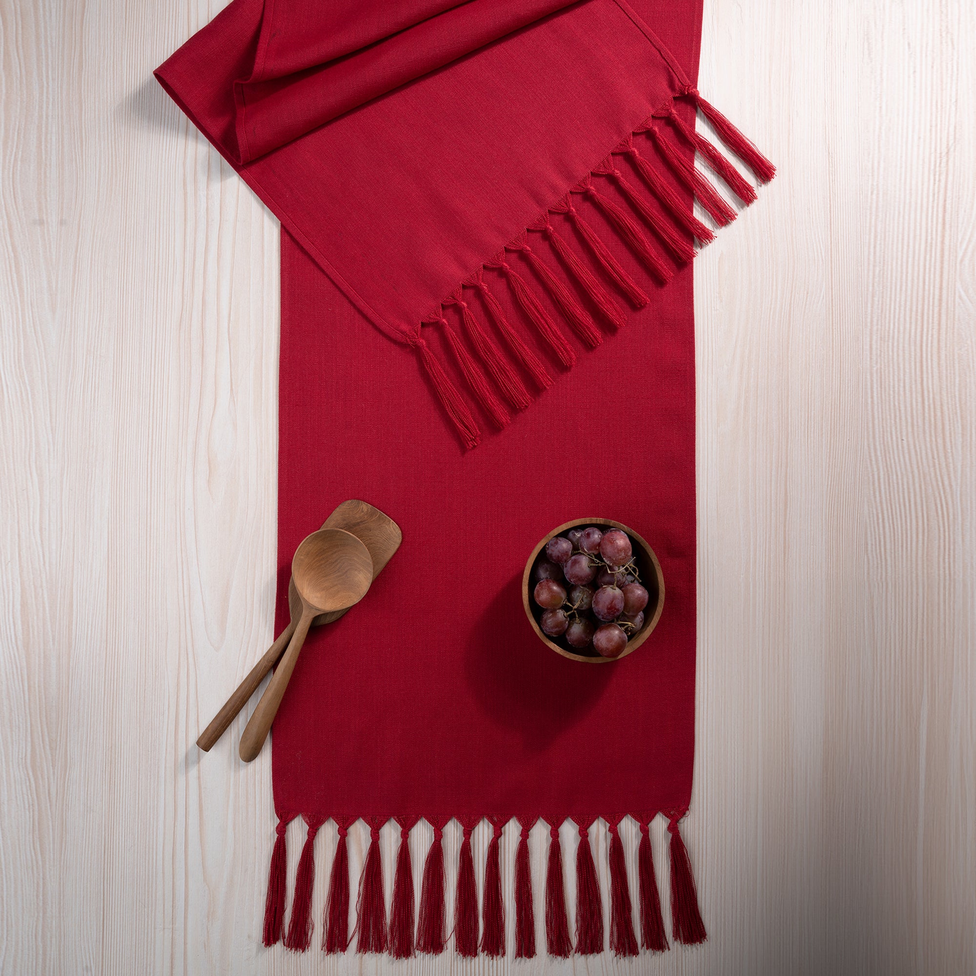Red faux linen table runner with matching D'Moksha table linens