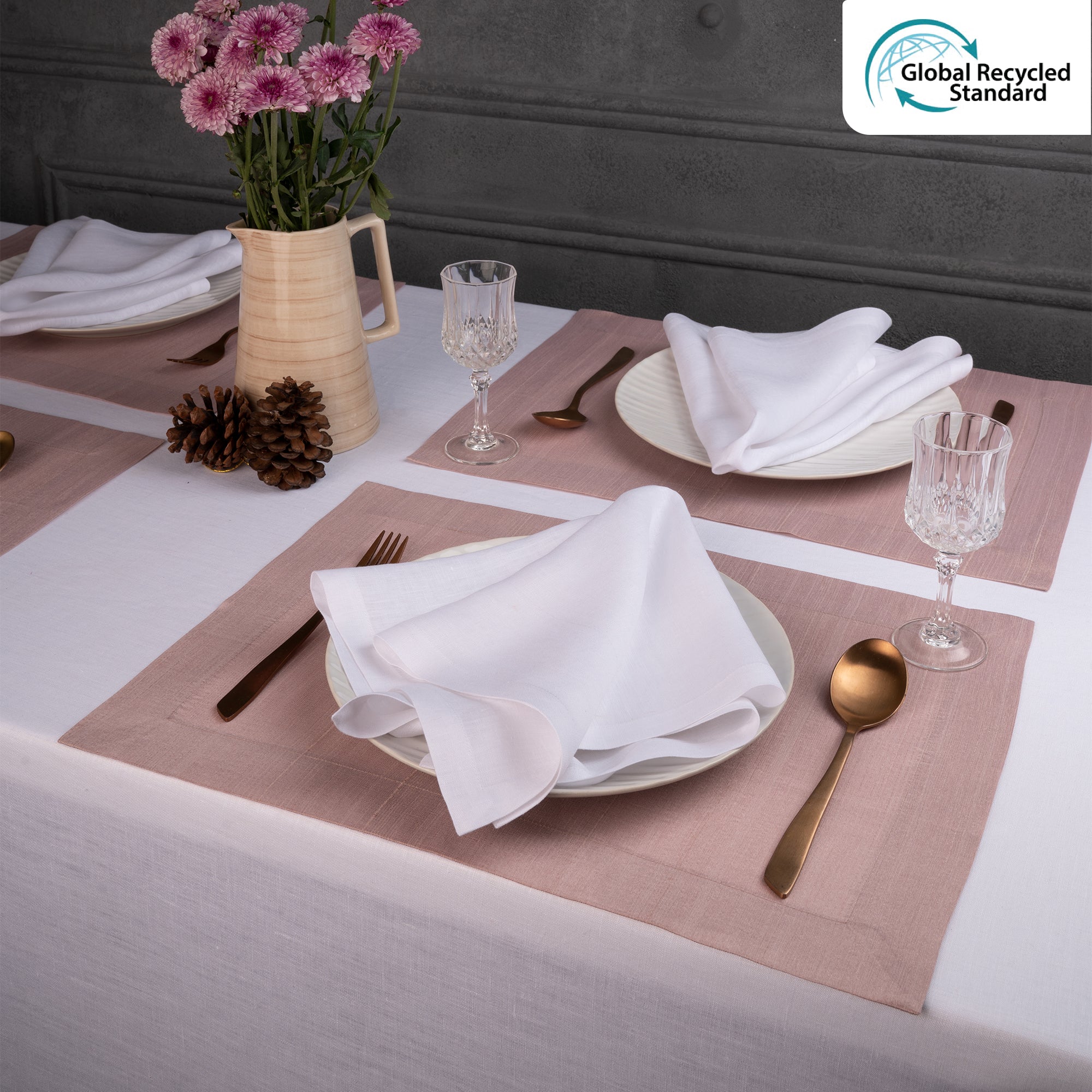 Rose gold Luxe Shine placemats styled on a dining table