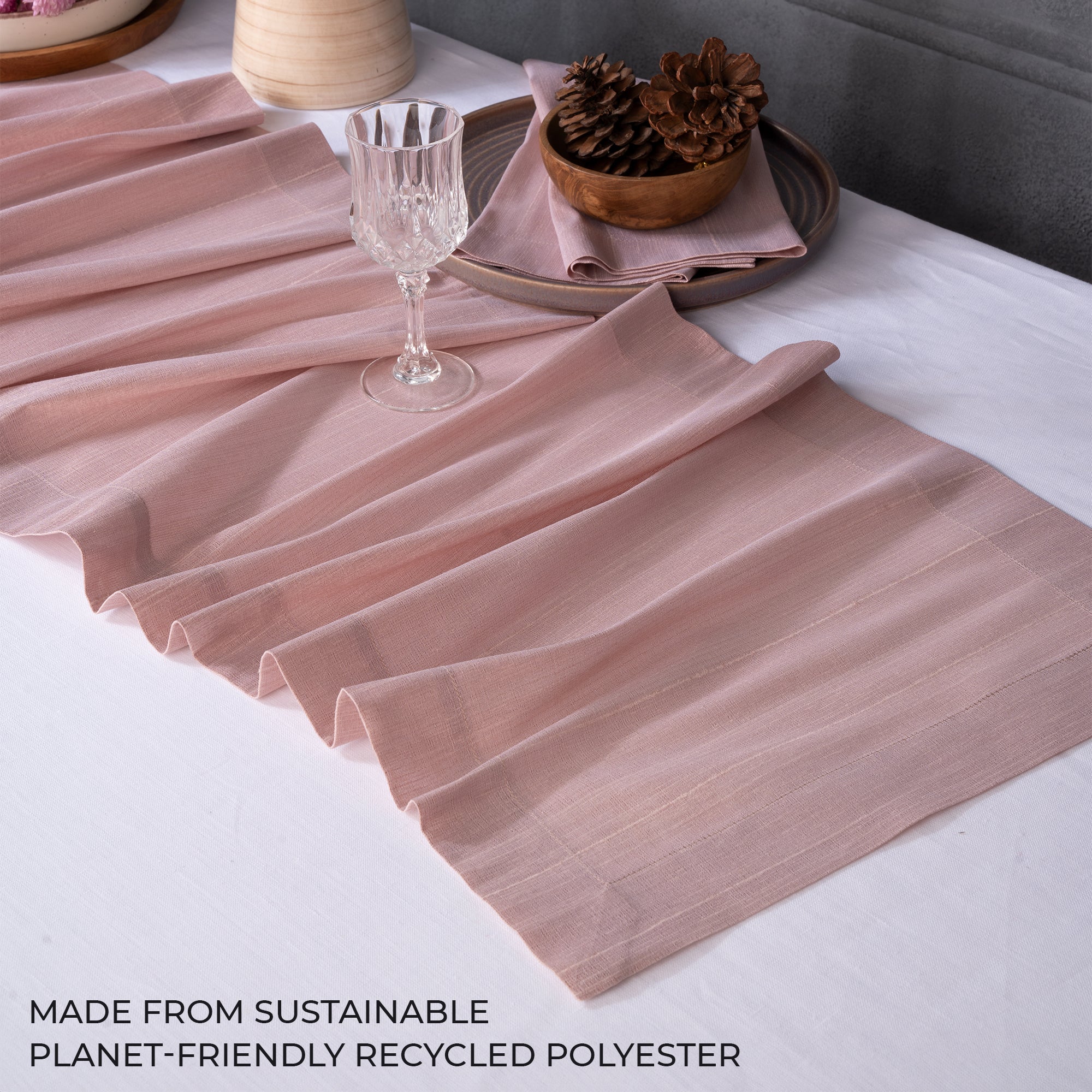Close-up of the mitered corners on a rose gold Luxe Shine table runner