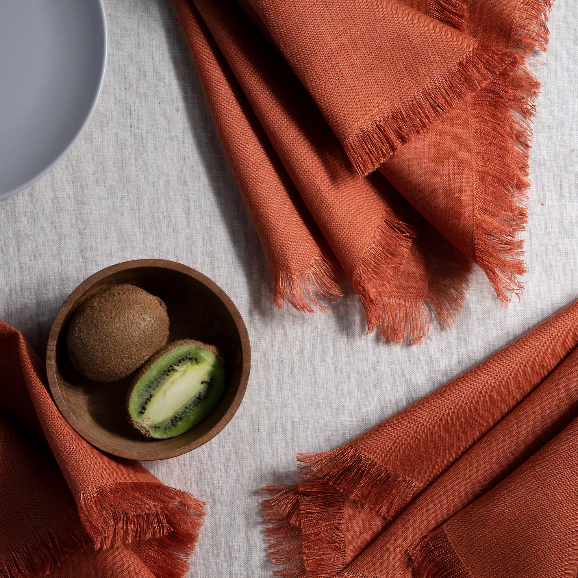 Rust pure linen dinner napkins with matching D'Moksha table linens