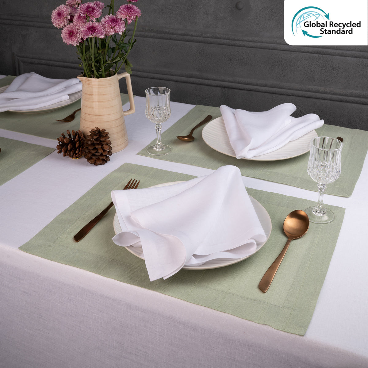 Sage green Luxe Shine placemats styled on a dining table