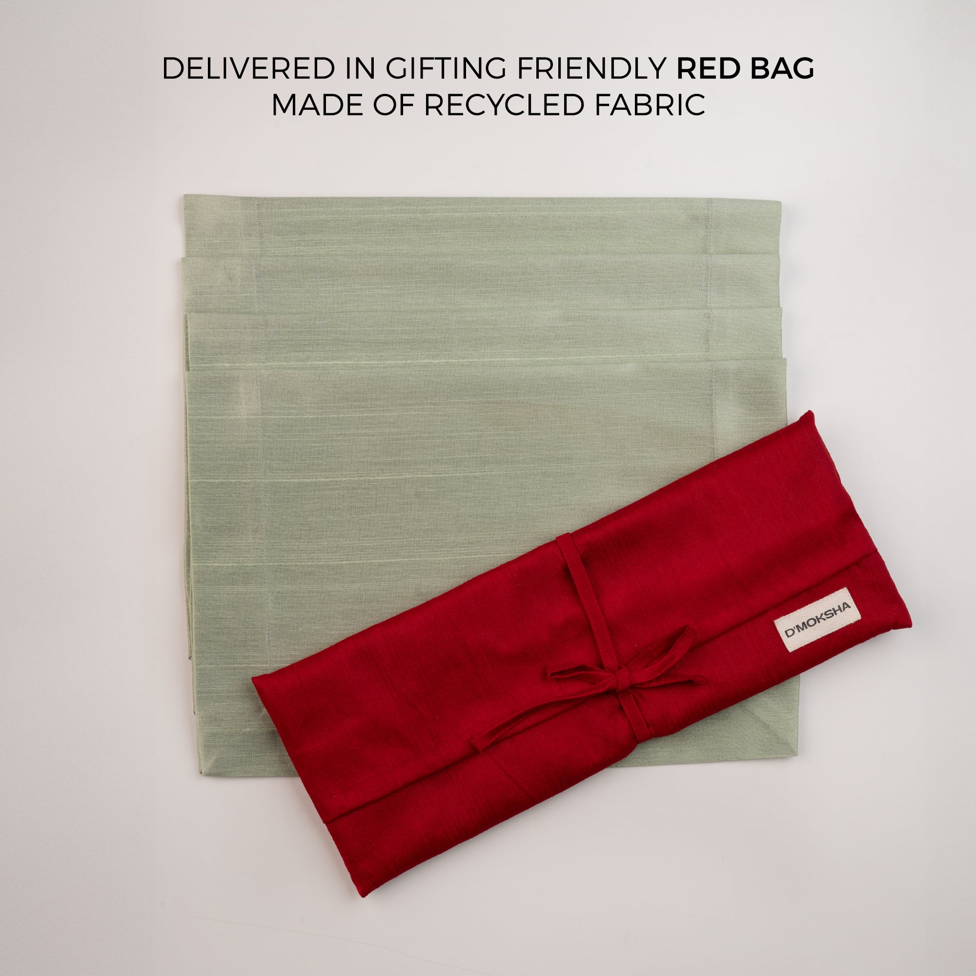 Sage green Luxe Shine placemats with matching D'Moksha table linens