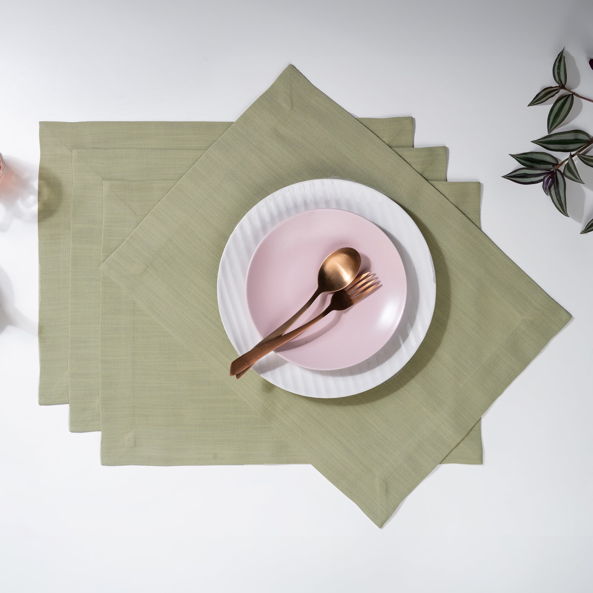 Sage green faux linen placemats with mitered corners, 14 x 19 inches, set of 4