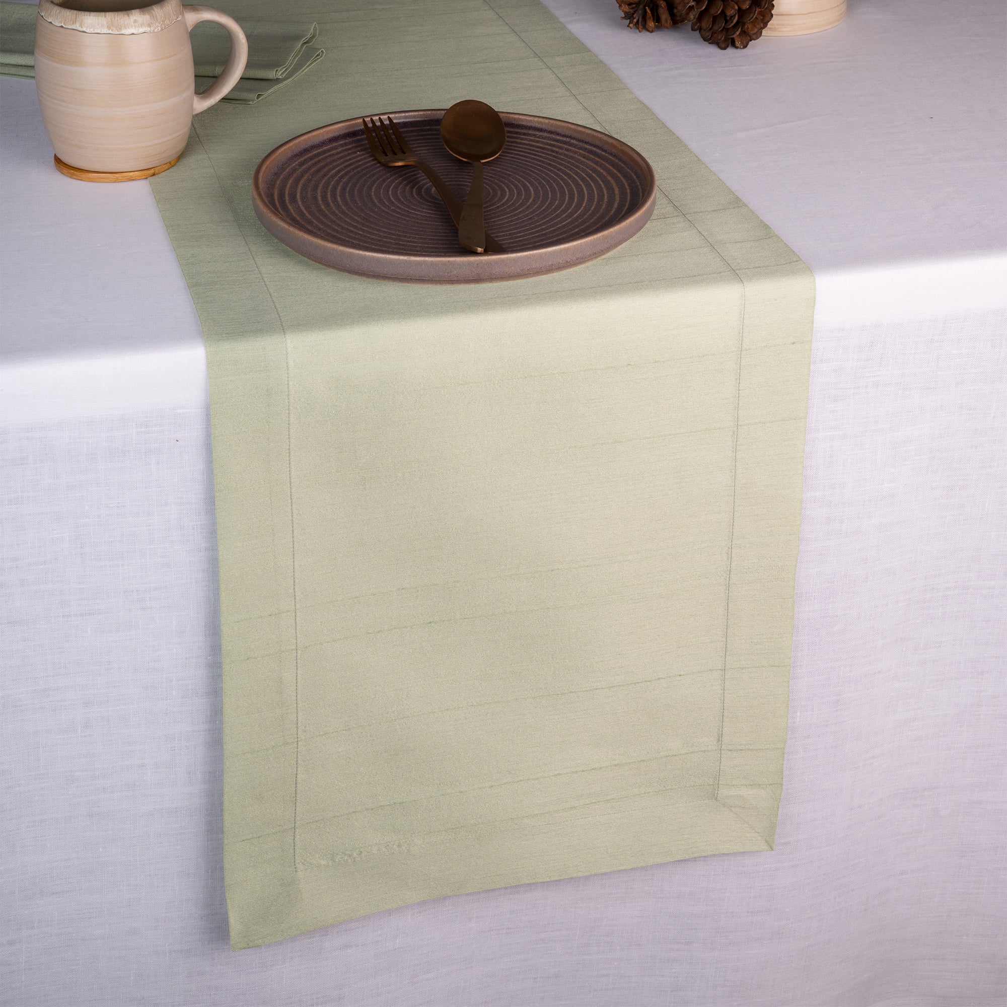 Sage green Luxe Shine table runner with mitered corners, 14 x 36 inches