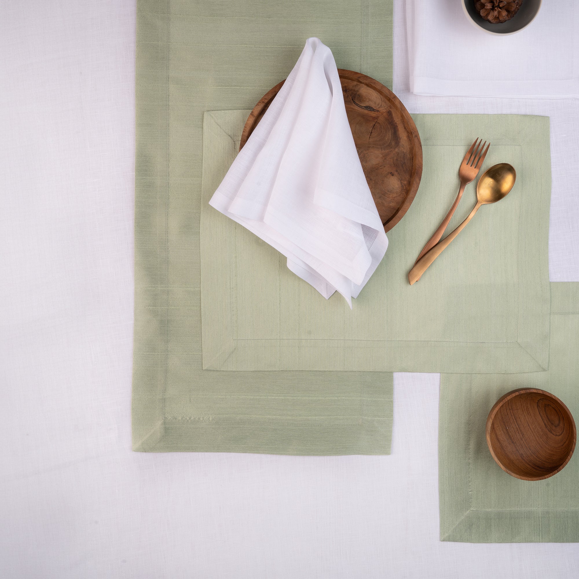 Sage green Luxe Shine table runner with matching D'Moksha table linens