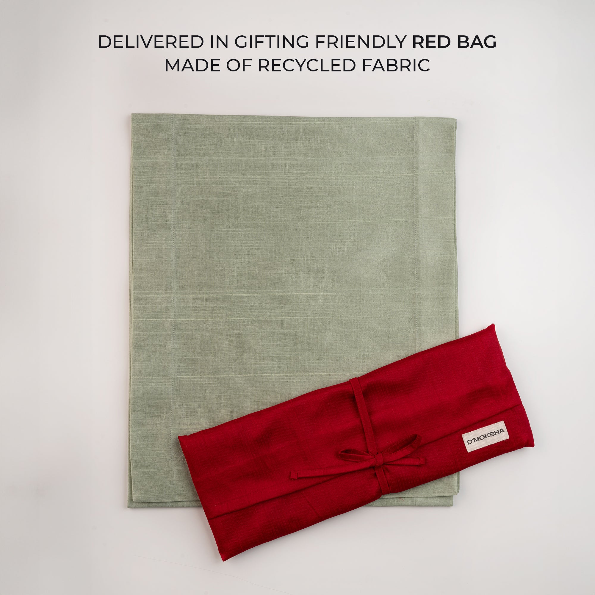 Sage green Luxe Shine table runner folded to show fabric texture