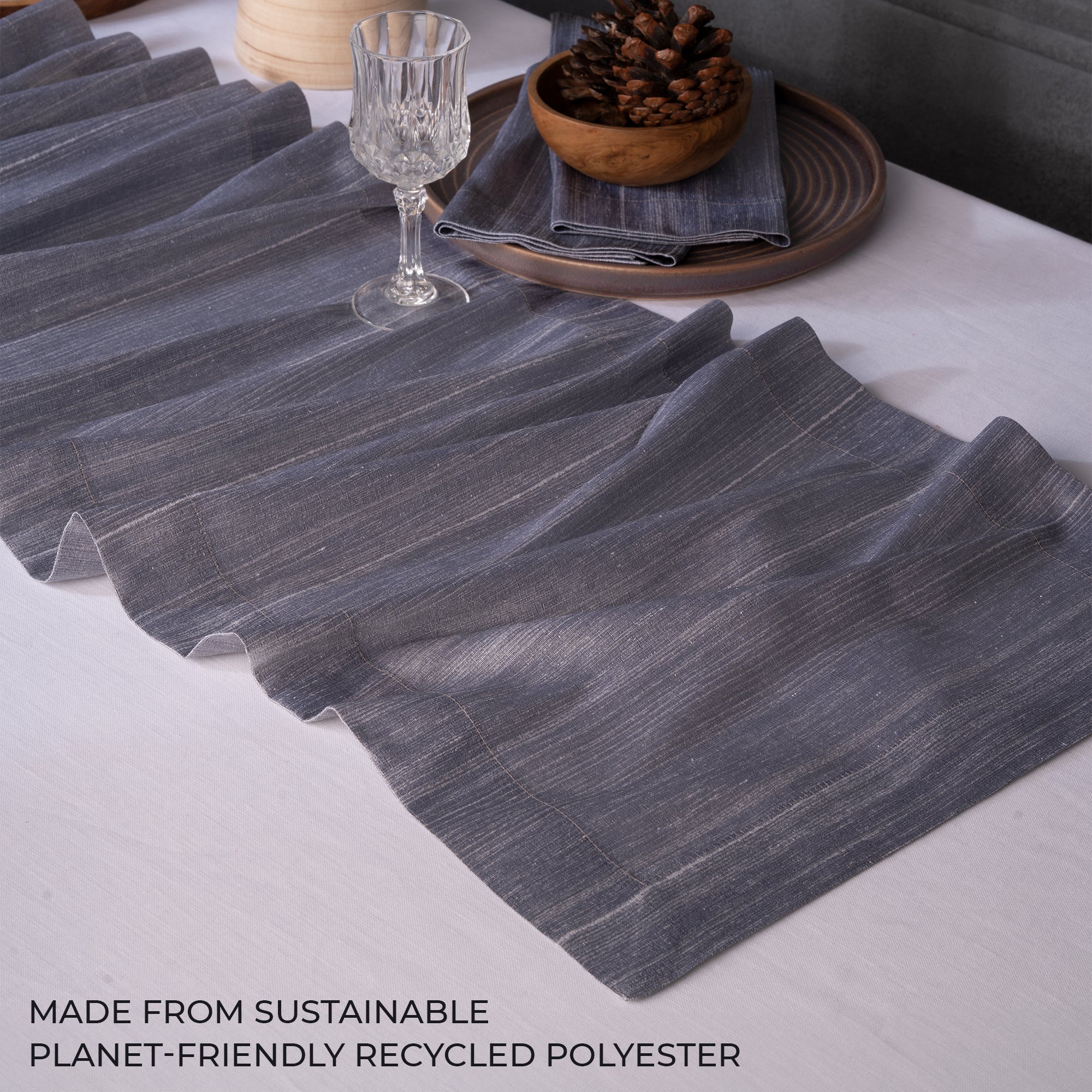 Close-up of the mitered corners on a steel grey Luxe Shine table runner