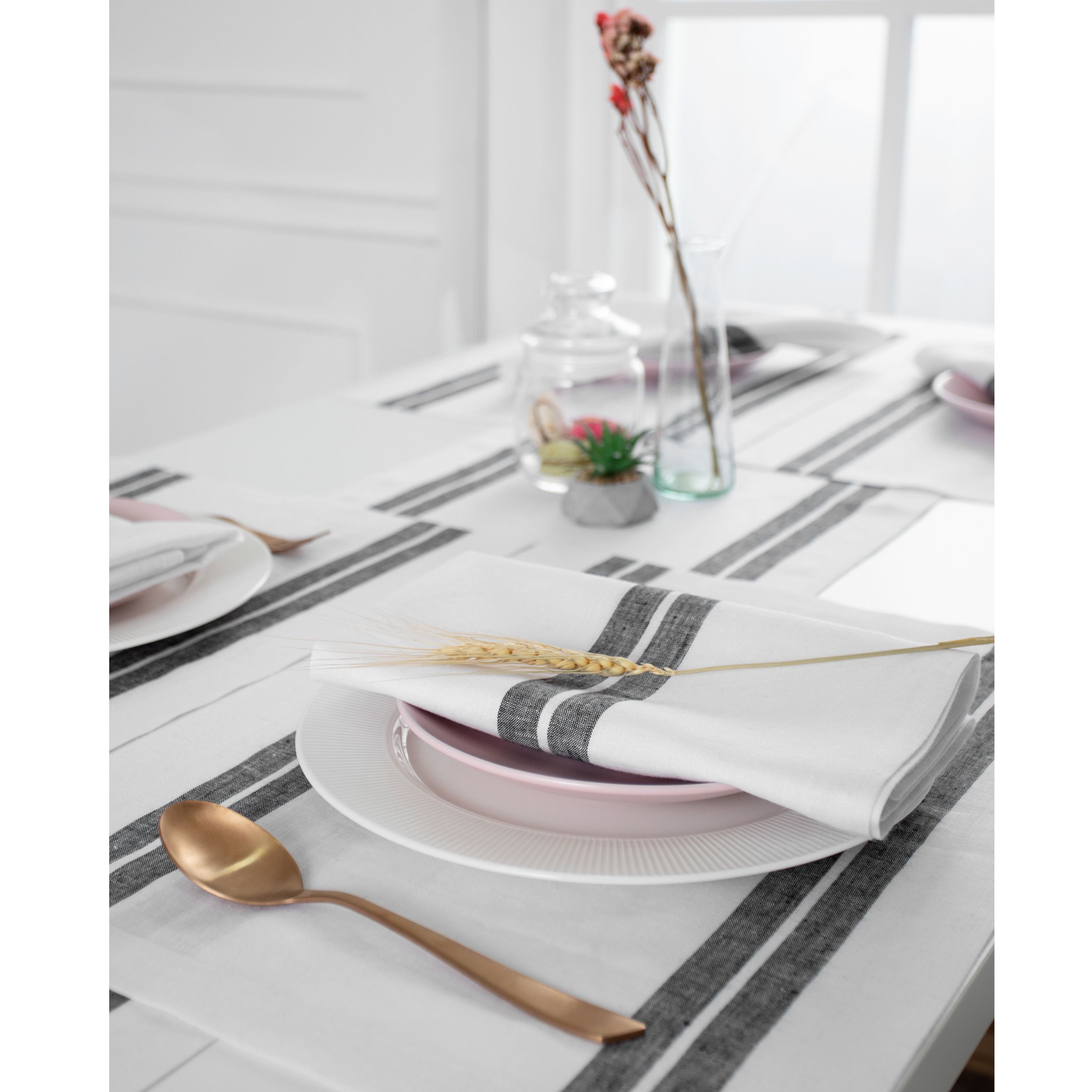 Close-up of the french stripe on white and black pure linen dinner napkins