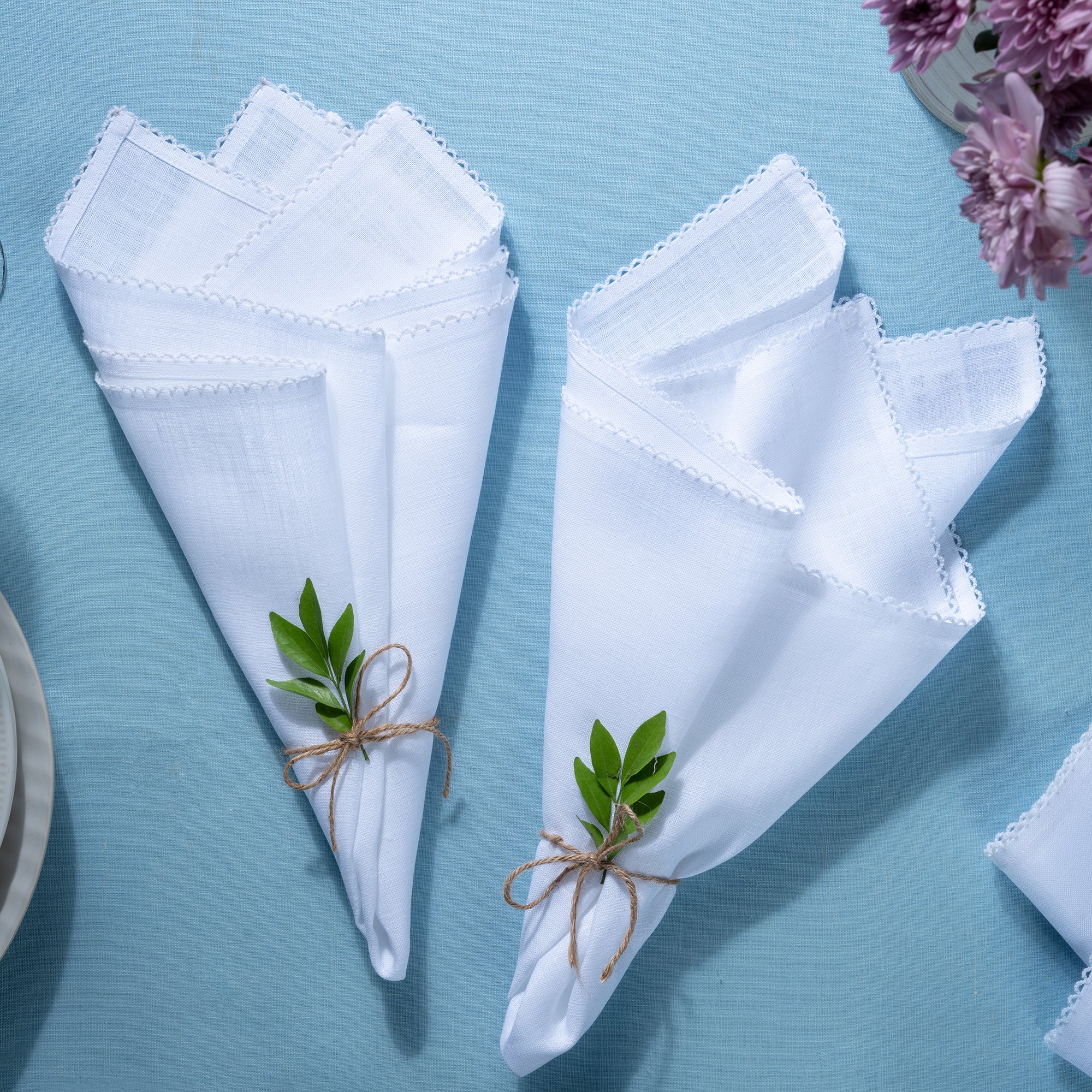 White and white pure linen dinner napkins with matching D'Moksha table linens