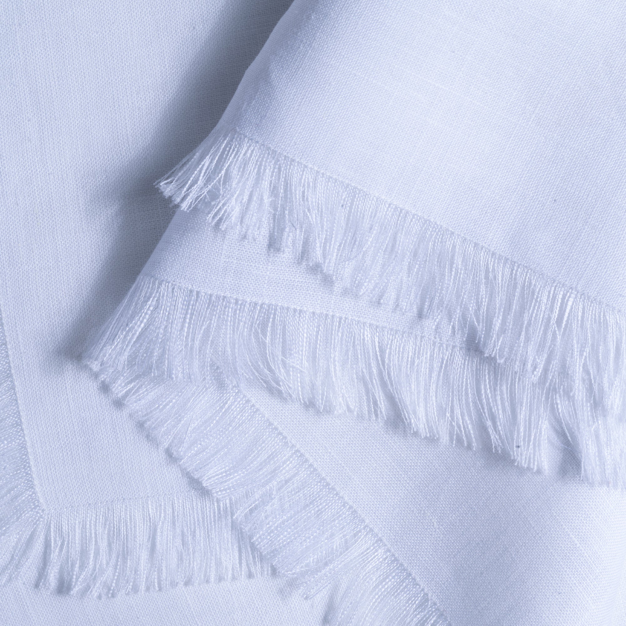 White pure linen dinner napkins folded to show fabric texture