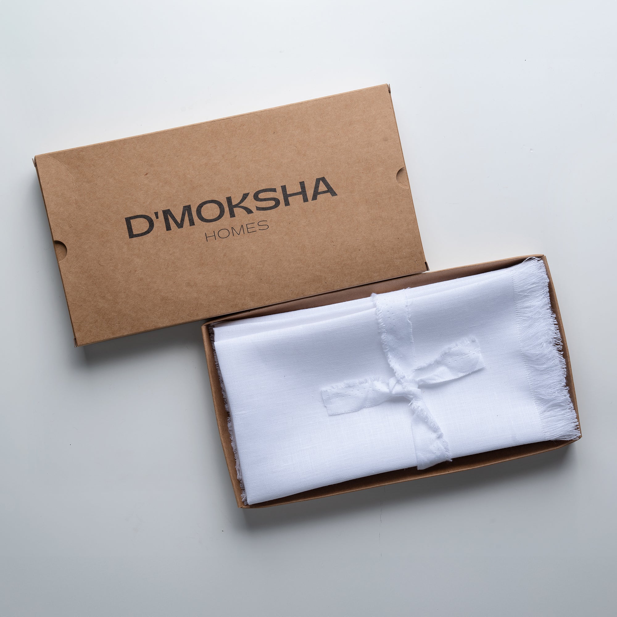White pure linen dinner napkins in a set table setting