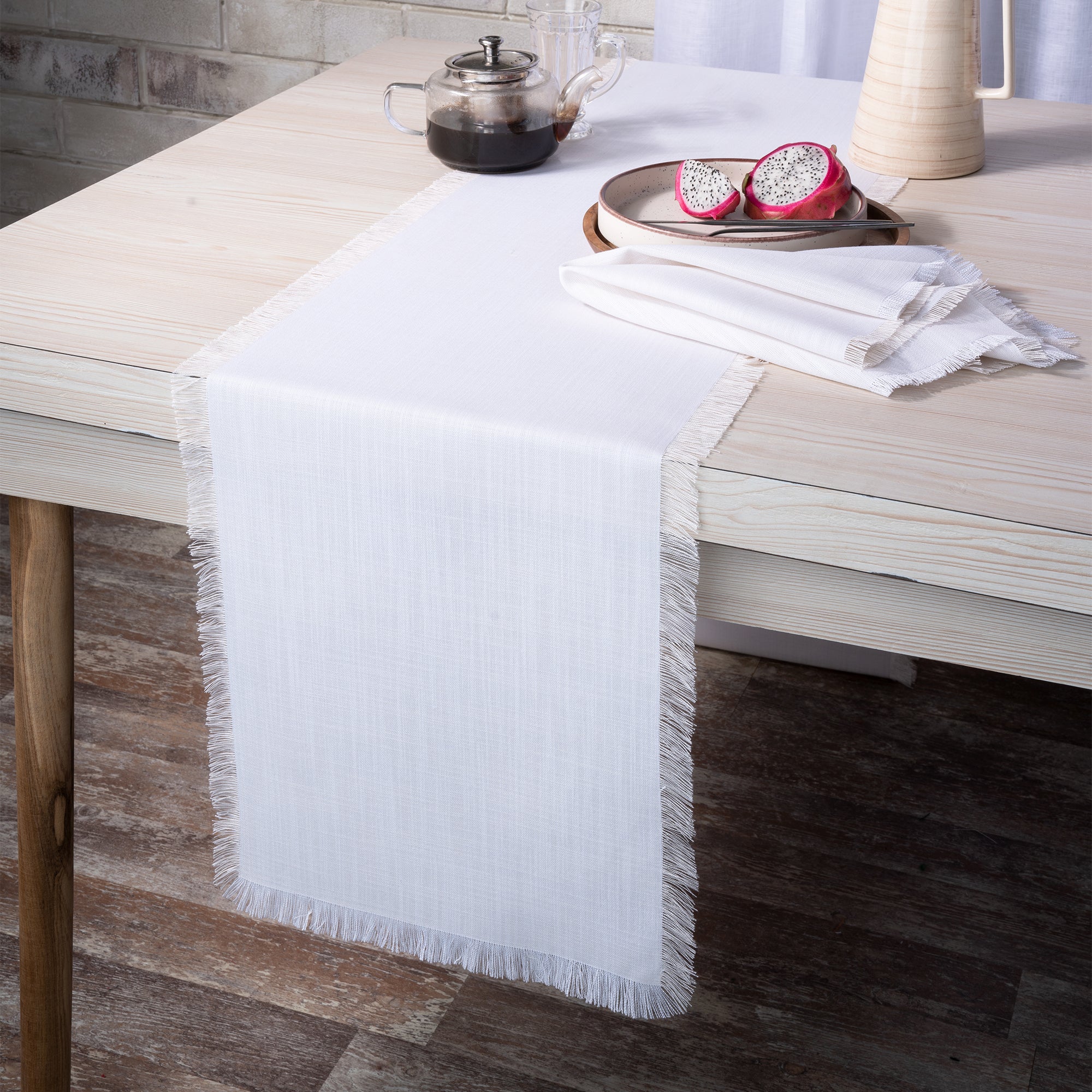 Chambray cream and white faux linen table runner styled on a dining table