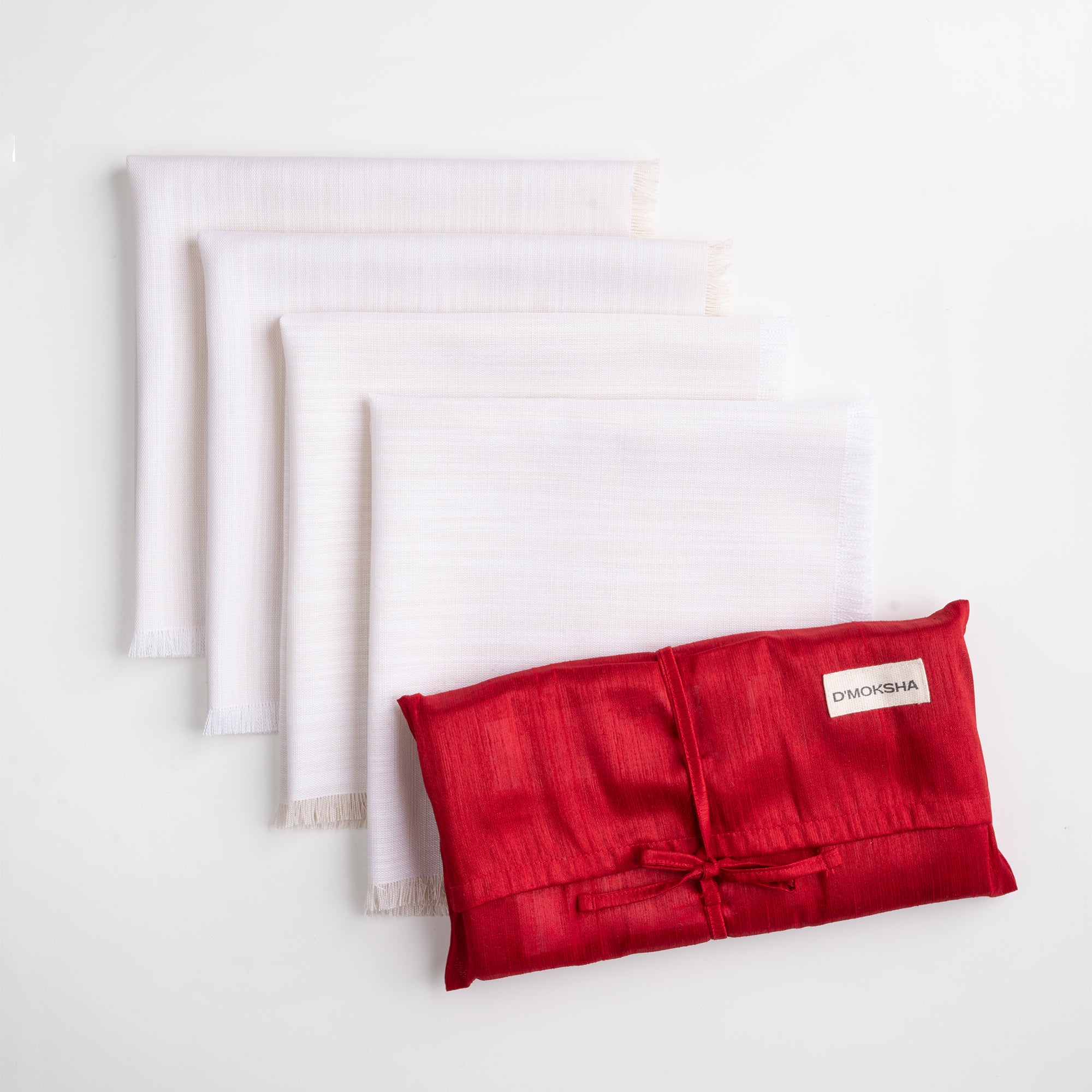 Chambray cream and white faux linen dinner napkins folded to show fabric texture