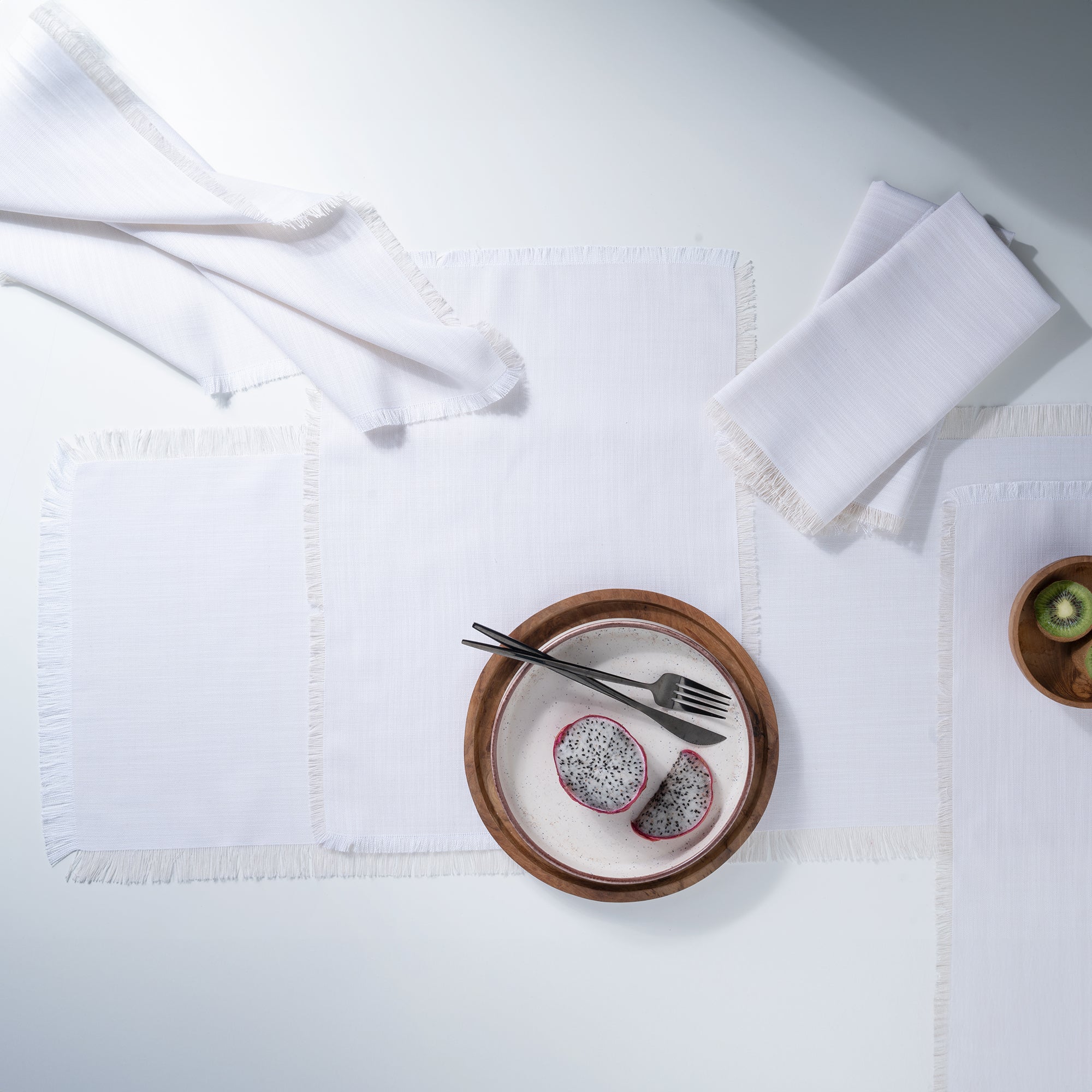 Chambray cream and white faux linen placemats with matching D'Moksha table linens