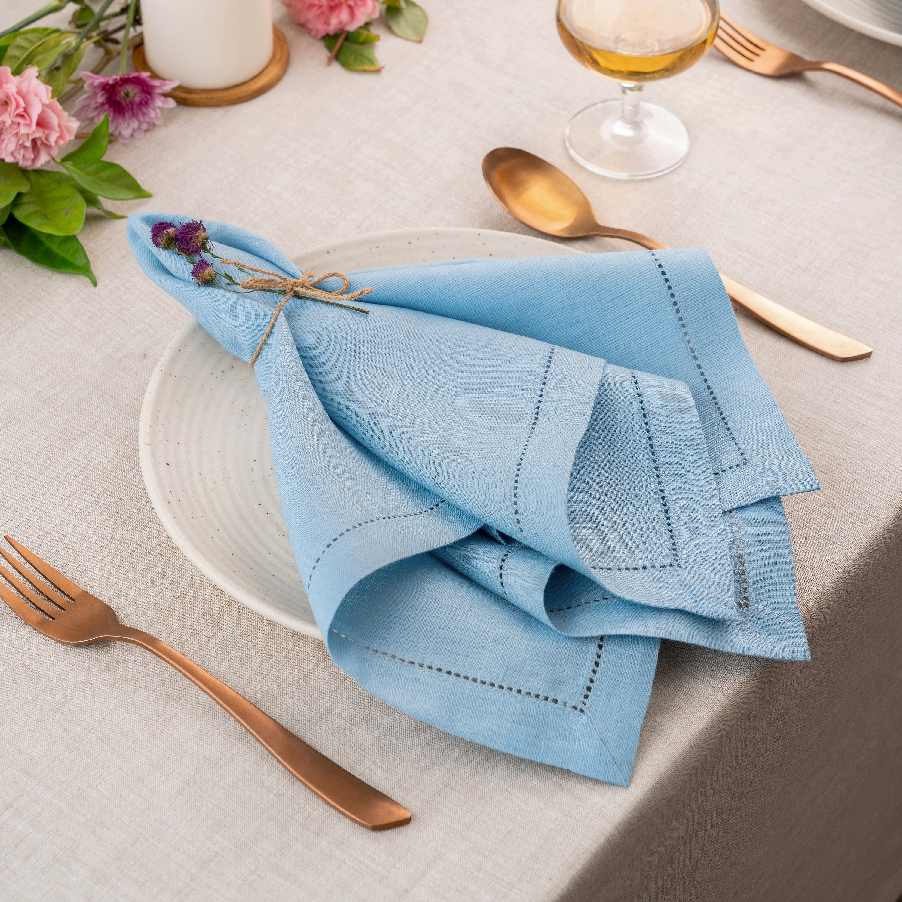 Close-up of the hemstitch edge on powder blue pure linen dinner napkins
